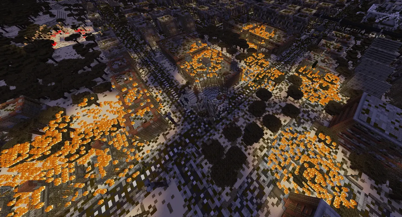 A city burning under artillery fire, seen from above