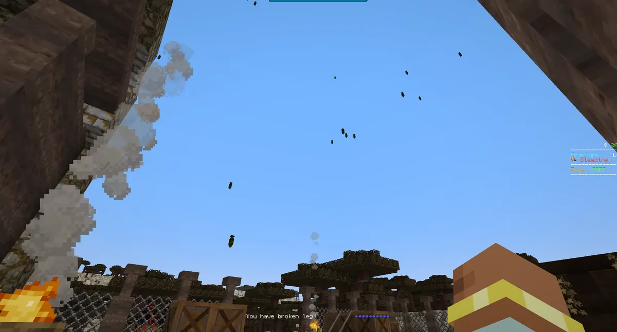 Shells falling through the sky above a fenced compound