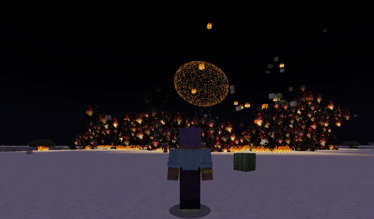 A nuclear fireball rising over a burning treeline at night