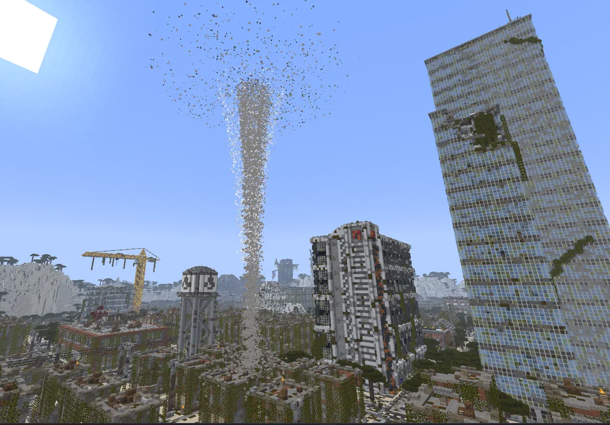 A tornado touching down between tower blocks in a ruined city